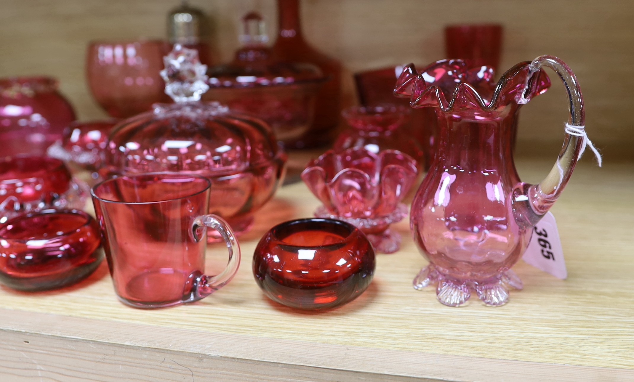 A collection of Cranberry glassware